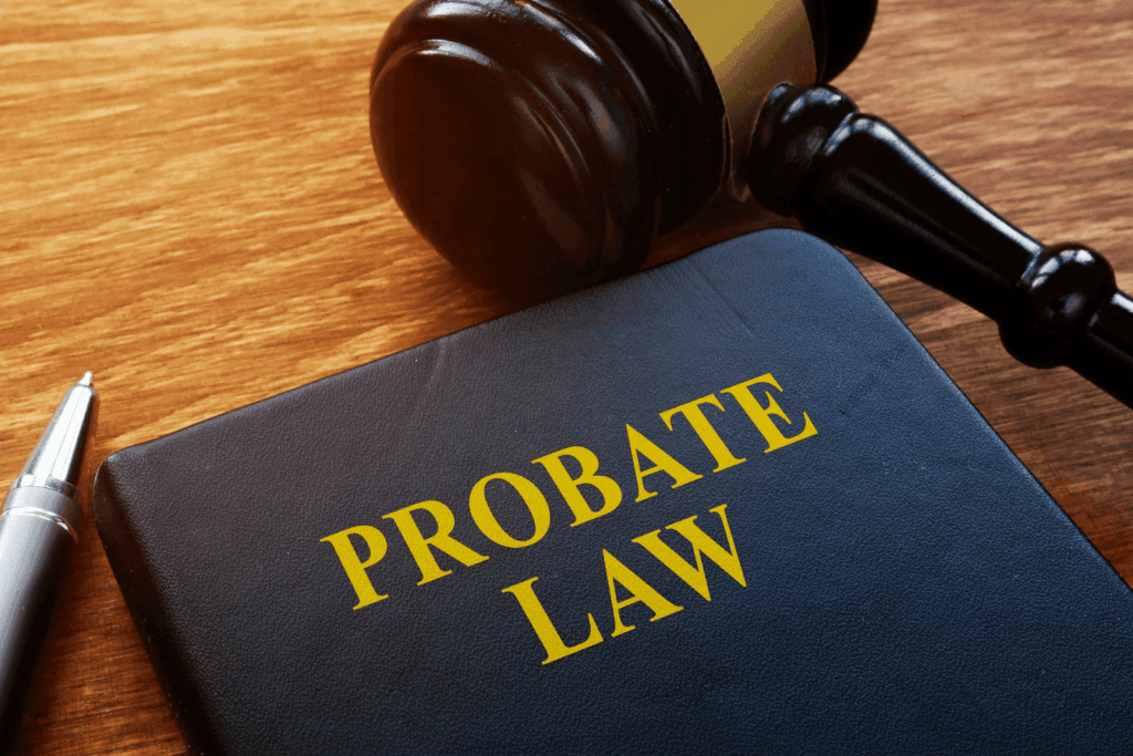 Probate law book with gavel on wooden table